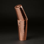 Copper Boston cocktail shaker set with the smaller tin tilted inside the larger one