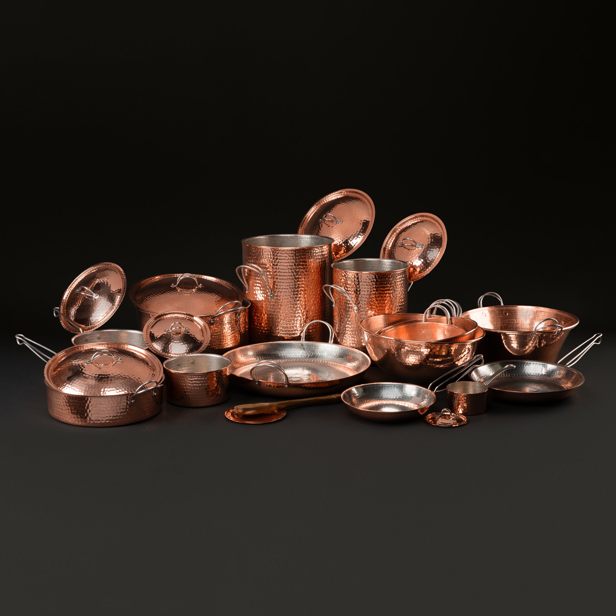The Kingdom set with lids lifted to show the tin-lined interiors of each pot